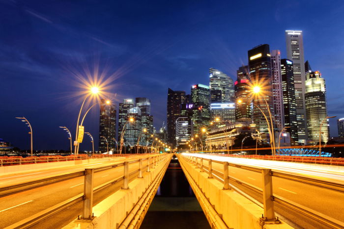 Stunning night cityscape photo using Canon 5D mark II. The starburst effect that you can see on the street lights is only possible with a small aperture.