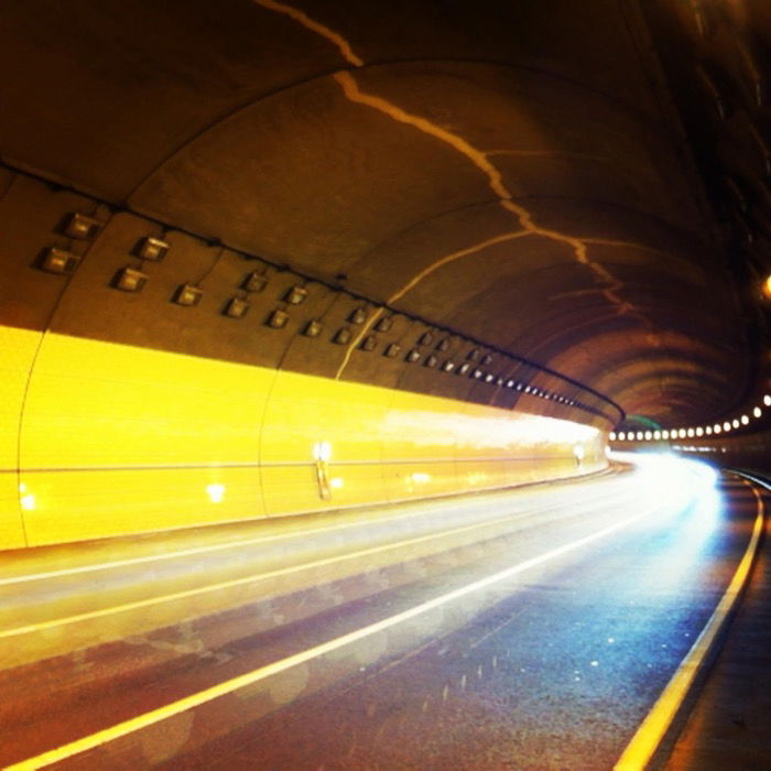 Atmospheric photo of a highway tunnel with streaming light trails an example of long exposure with a smartphone