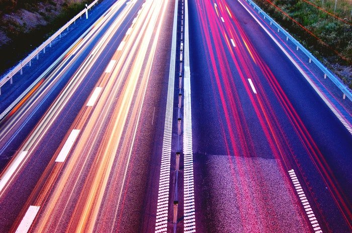 colored light trail from cars on a busy motorway