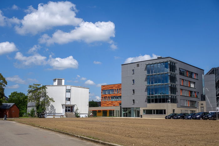 A photo of industrial type buildings on a cloudy day 