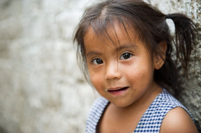 A close up portrait of a little girl taken by a travel photographer