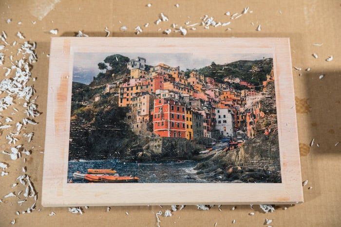 The final image - colorful coastal town photo transferred to a wooden board