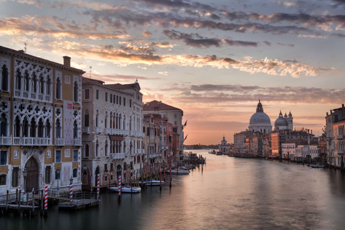 A serene photo of Venice buildings and water used digital blending to balance the exposure across the frame.