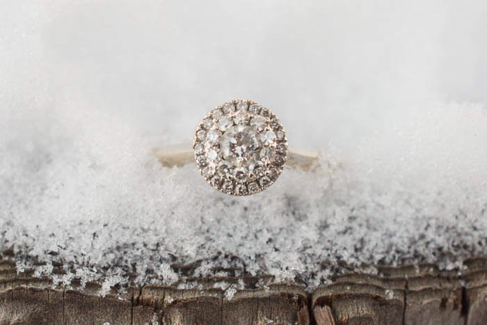 close up photo of engagement ring in ice. Wedding photography gear