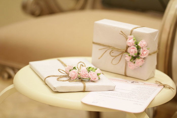 A still life photo of wedding presents on a table. Wedding photography gear