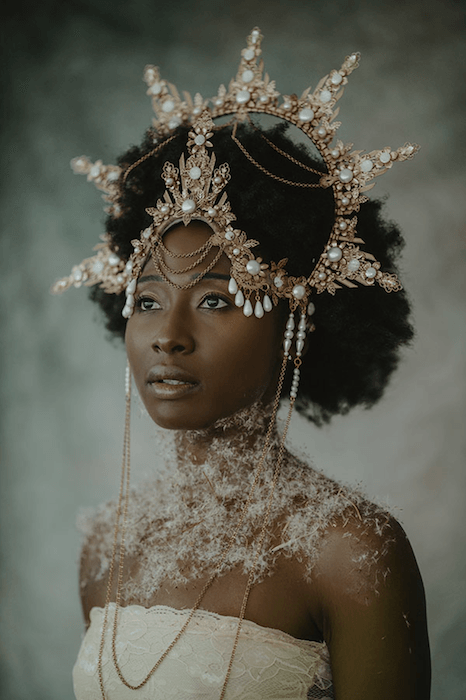 fine art portrait photography of a woman in a headdress and fancy dress
