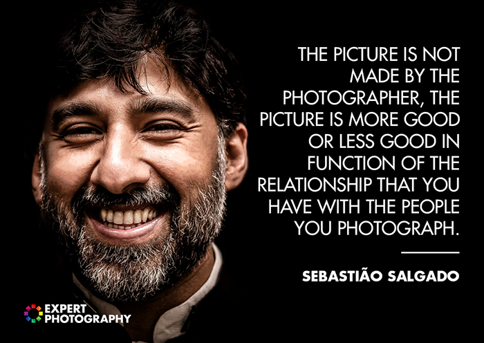 A close up portrait of a smiling bearded man on dark background overlayed with a quote from Sebastiao Salgado - good photography quotes from famous photographers