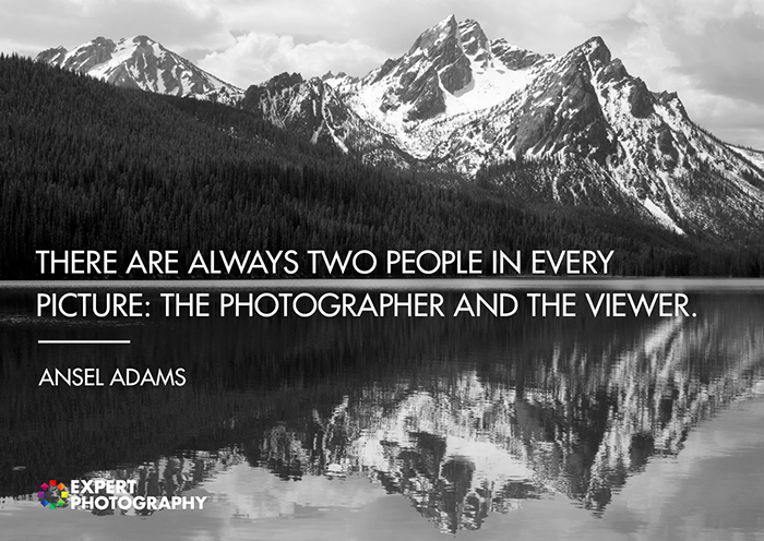 A majestic black and white mountainous landscape shot overlayed with a quote about good photography from Ansel Adams