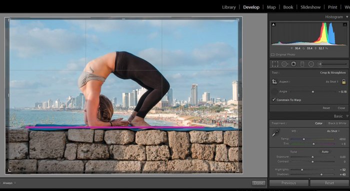 changing aspect ration of a photo of a woman in a yoga pose on a stone brick wall in lightroom