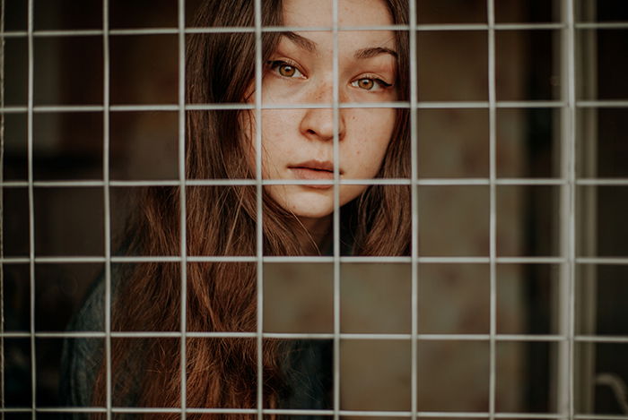 A cut-out photo portrait of a brown haired girl