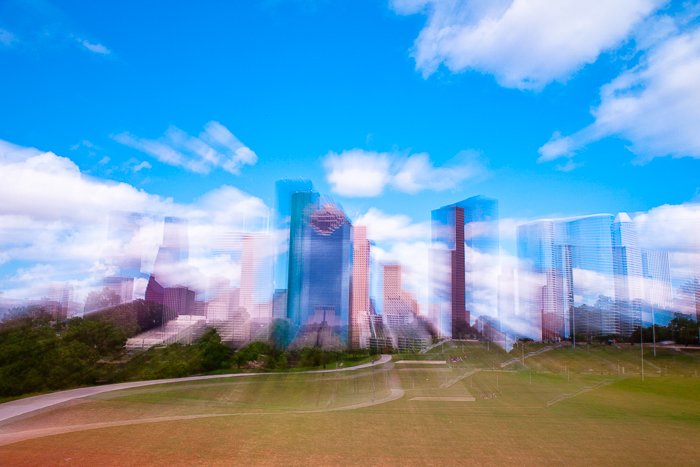 City buildings against a bright sky shot with slow shutter for blurring effect