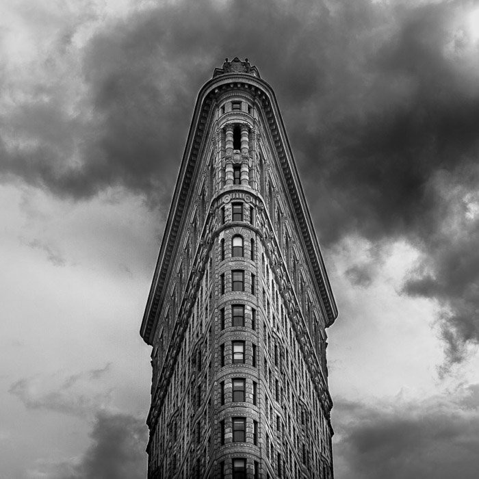 Black and white architecture photography shot of the facade of the Flatiron building in New York