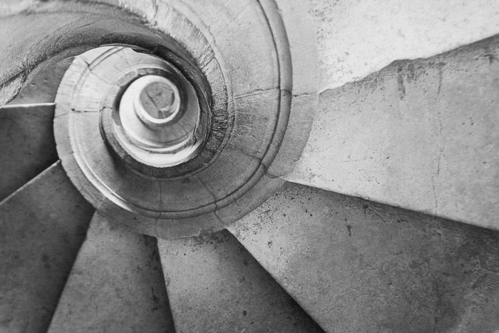 Black and white shot of a spiral staircase in the castle of the Knights Templar. Tomar, Portugal