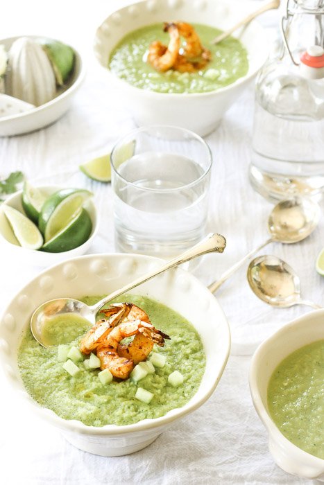 Food styling: A bright and fresh feeling photo shoot of a lunch setup including green soup with pawns 