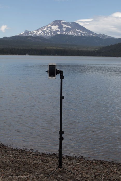 Using a tripod for an iphone photo pointed towards a lake and mountain