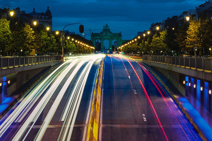 A busy motorway with colorful light trails from the traffic in Brussels