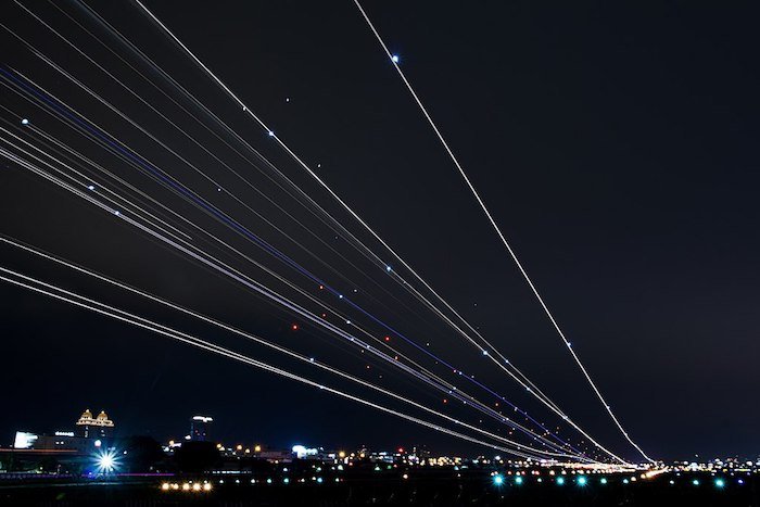 Light trails from landing/taking off planes.