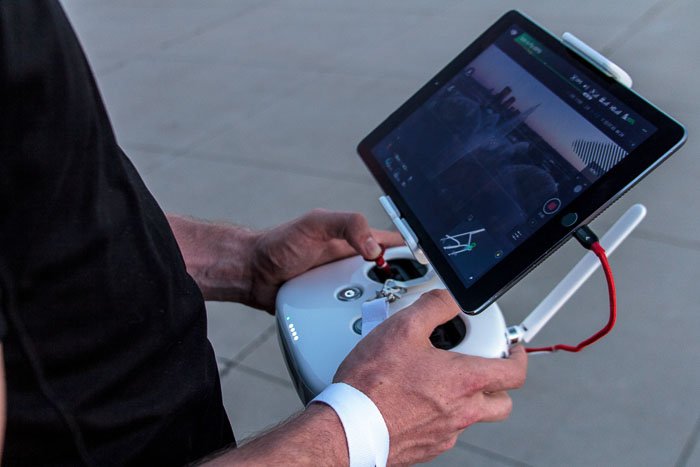 Close up of a man with remote control for drone photography