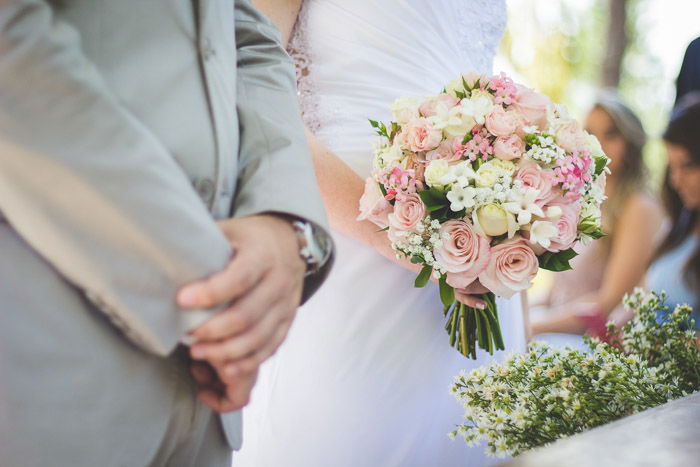 A closeup portrait of the bride and groom taking their vows