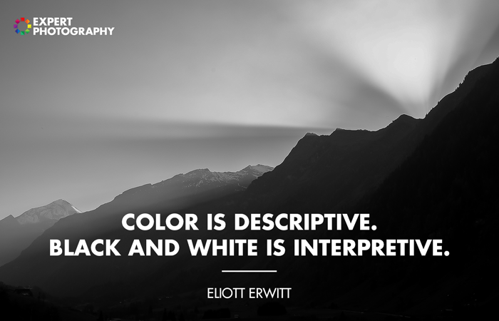 Atmospheric landscape photo of a mountainous landscape overlayed with black and white quote from Eliot Erwitt
