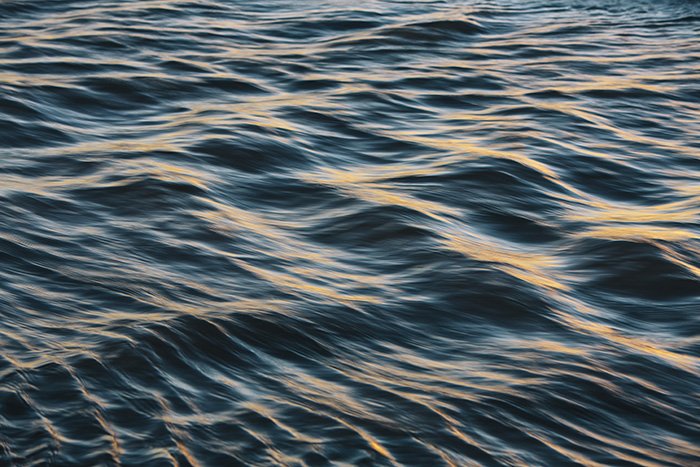 Detail of sunlight reflecting on small waves.