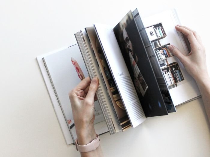 Photo of someone flipping through a photo book