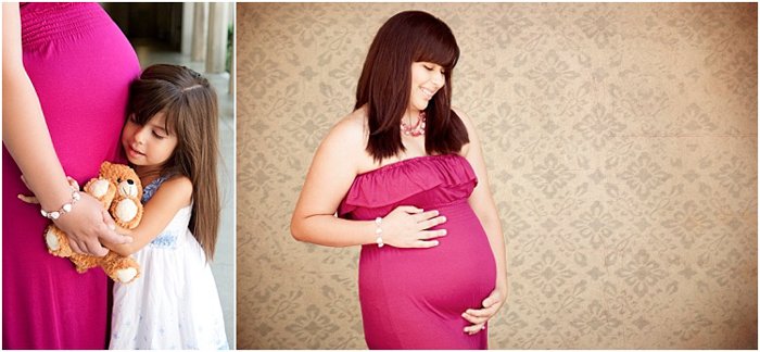 maternity photoshoot, pregnant woman in a pink dress, her daughter hugging her round her belly