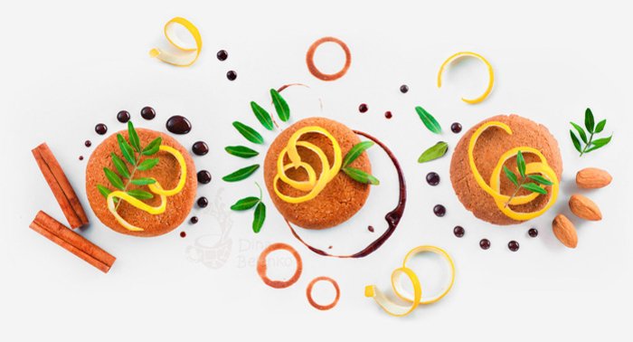 饼干装饰平铺。食物造型提示图案由饼干，巧克力和戒指，肉桂，柠檬皮和绿叶。