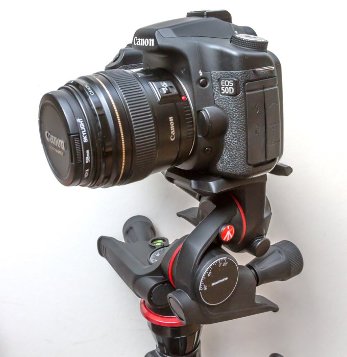 A DSLR camera mounted on a gearded hear for shooting time-lapse photography subjects