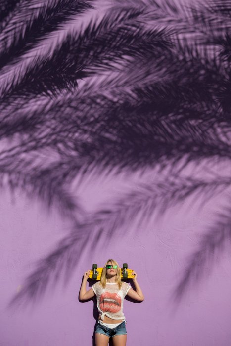 A fashion photography shot featuring strong use of complementary colors yellow and purple 