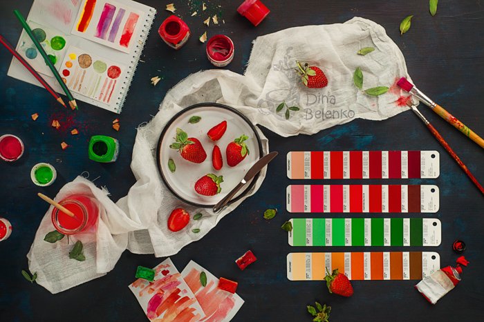 A flat lay photo themed with red and green complementary colors