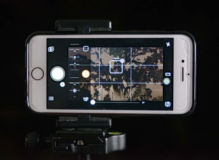 A smartphone set up on a tripod for good lighting