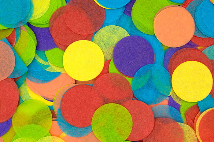 Coloured diy photography backdrops made from tissue paper cut into circles 