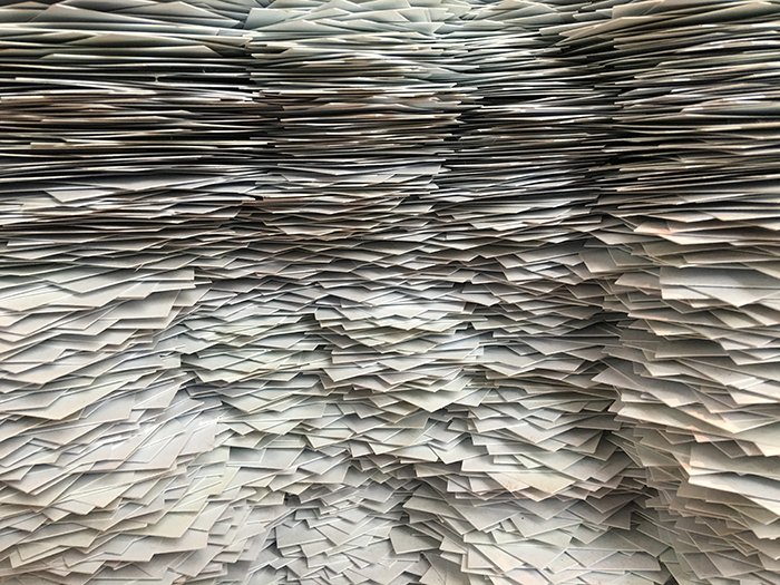 A large pile of newspapers to be used as diy photo backdrops