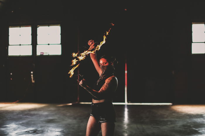 Atmospheric shot of a female fire-dancer - photography workflow