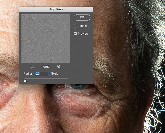 A screenshot of Photoshop with a photo of an older man in the background and the High Pass settings panel in the foreground