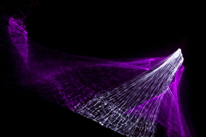 Stunning purple reflected light patterns on black background