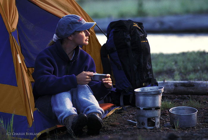 A photographer resting in a tent at Three Sisters Wilderness, Oregon