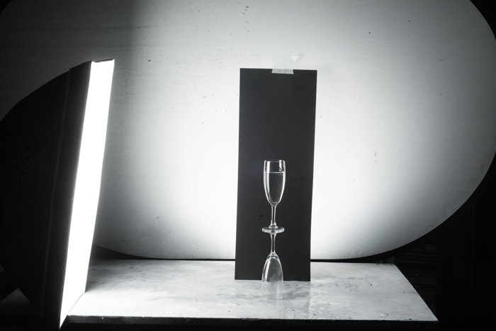 Shooting wine glass photography against a black background