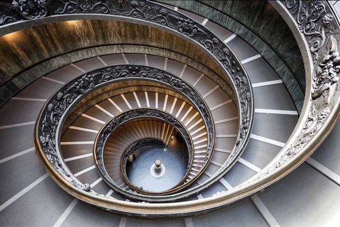 A beautiful spiral staircase in the vatican museum in rome shot using best architecture photography equipment