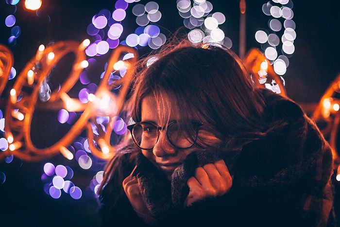 A female potrait at night with bokeh lights background