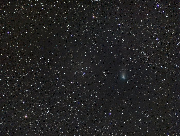 A deep sky photo with a smudgy comet