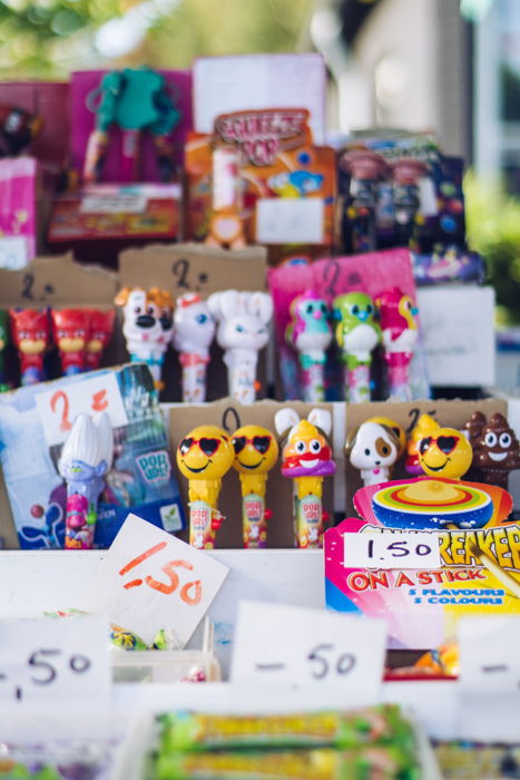 A close up of colorful kids toys and sweets displayed in a shop