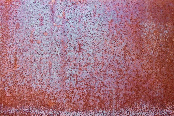 Red rust covered walls - industrial photography detail