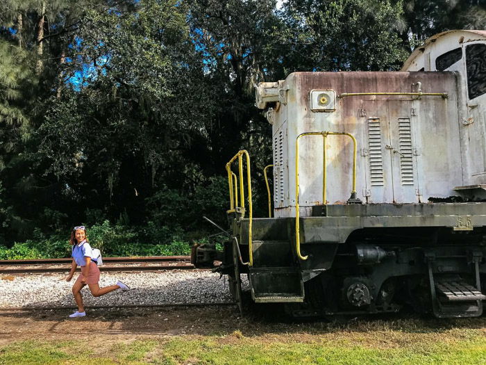 An action shot of a young girl running from a train taken using iphone burst mode