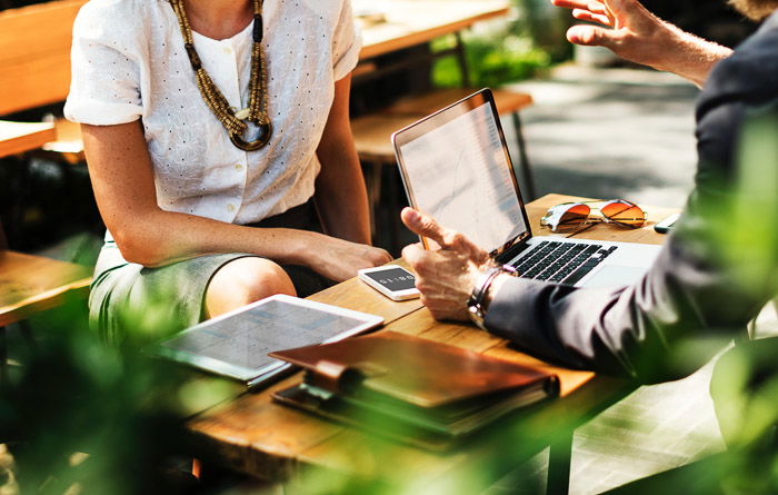 Close up shot of people making a photography marketing plan 