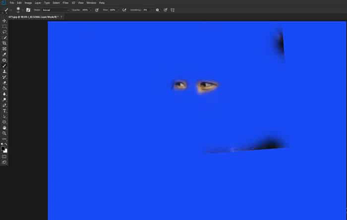 Screenshot of eyes against a blue background showing how to merge photos in Photoshop