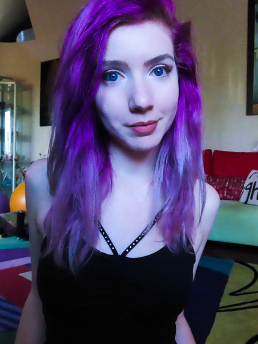 An indoor portrait of a purple haired female model, taken with canon powershot sx740 hs