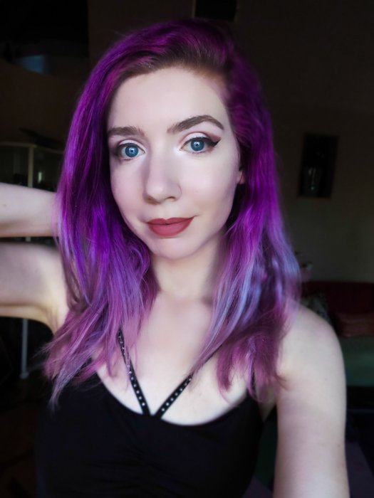 An indoor portrait of a purple haired female model, taken with canon powershot sx740 hs
