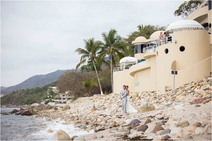 Beautiful wedding portrait of the couple embracing on a tropical beach